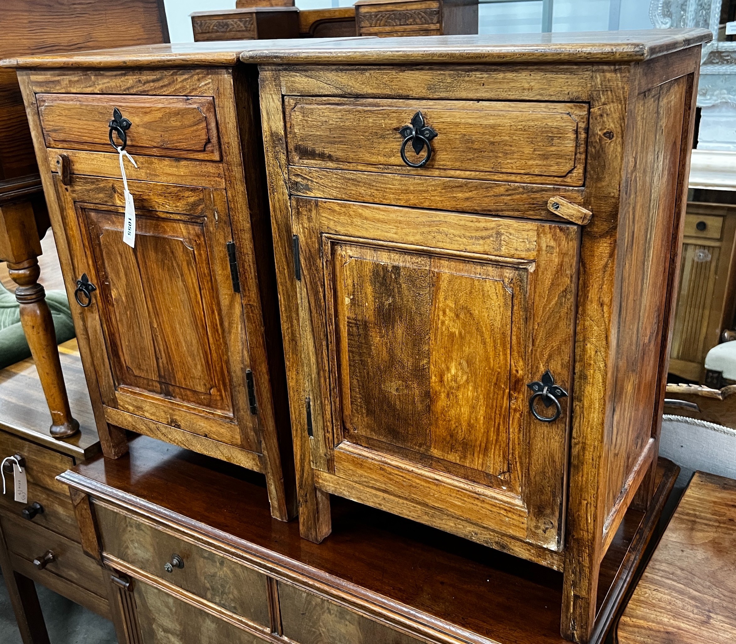 A pair of Indonesian hardwood bedside cabinets, width 43cm, depth 31cm, height 64cm